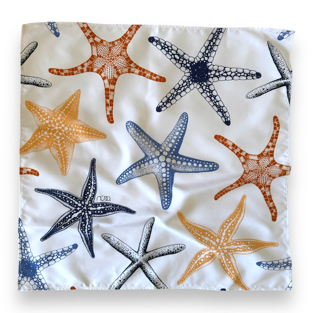 Fabric with colorful starfish pattern on a white background