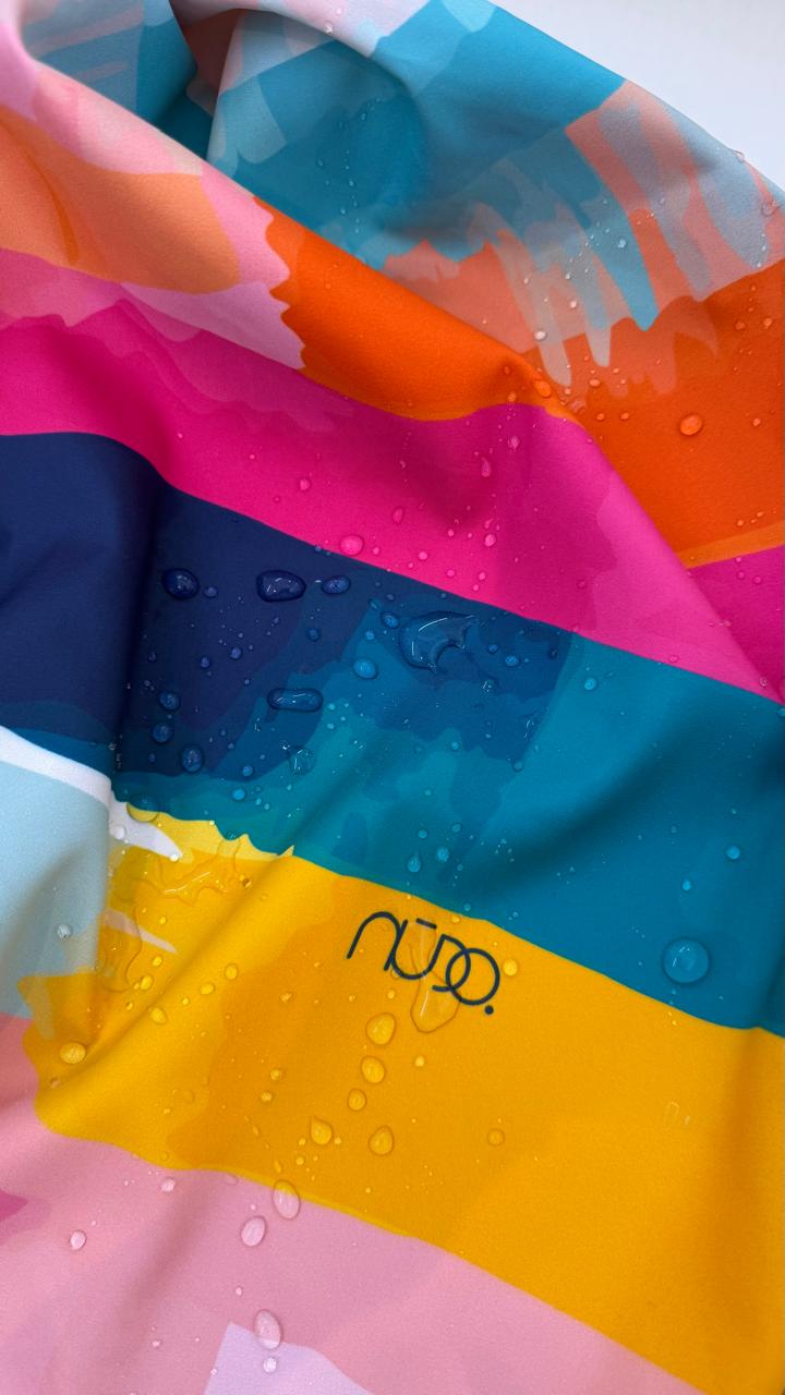Nudo Bold Stripes square scarf closeup with abstract watercolor bands in pink, turquoise, orange, yellow and navy, with water drops